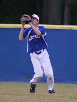 Center fielder Caleb Garrett hauls in a flyball during Monday's game. (Photo by Rick Nation)