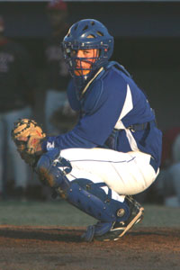 Senior catcher Kaleb Jobe looks to the Bryant dugout for a pitch call during a recent Hornets game. (Photo by Rick Nation)