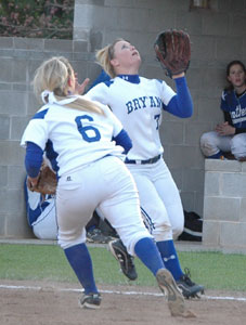 Christen Kirchner (7) settles under a pop up as teammate Peyton Jenkins hustles to cover first during Monday's game against Greenbrier. (Photo by Mark Hart)