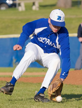 Pitcher Caleb Milam fields a slow roller off the right side of the mound during Tuesday's game against Little Rock Catholic. (Photo by Daniel Sample)