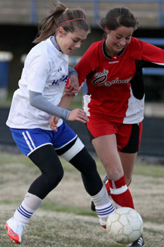 Haley Montgomery, left, contends with a Russellville player for possession during Tuesday's game at BHS. (Photo by Misty Platt)