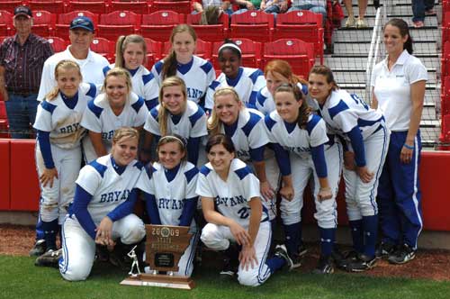 Head coach Lisa Stanfield, back right, and assistant Chris Kirchner join in the Lady Hornets team picture with their State runner-up trophy after Saturday's game at Bogle Park in Fayetteville. (Photo by Mark Hart)