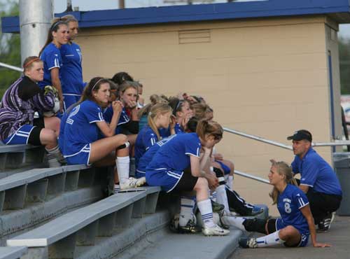 Head coach Doug Maxwell talks with the Lady Hornets during halftime of a game earlier this season. (Photo by Rick Nation)