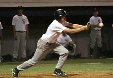 Caleb Garrett gets a bunt down during the tell-tale seventh inning of Tuesday's game. (Photo by Rick Nation)