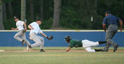 Shortstop Tyler Sawyer takes a throw and moves to tag out basestealer Jordan Getchall during the third inning of Tuesday's game. (Photo by Rick Nation)