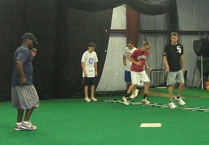 J.J. Meadors, left, puts, from left, Evan Castleberry, Landon Pickett, Tyler Brown and Caleb Milam through his speed and agility workout at DiamondSports.
