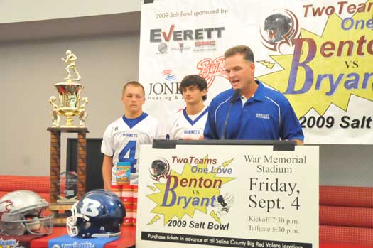 Coach Paul Calley, flanked by Logan Garland (4) and Jimi Easterling, speaks at Tuesday's Salt Bowl press conference. (Photo by Kevin Nagle)