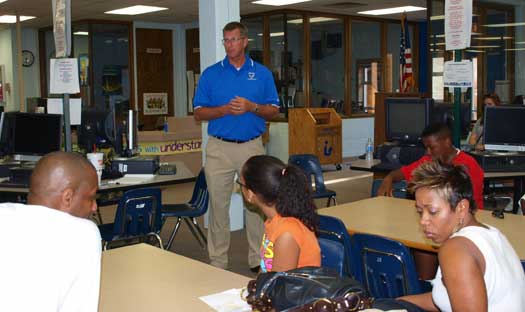 Principal Randy Rutherford talks with the parents of incoming frehshmen at the Back To School Bash. (Photo by Lana Clifton)