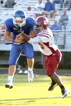 Bryant's Logan Garland (4) hauls in a touchdown pass. (Photo by Rick Nation)