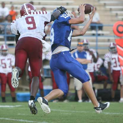 Bryant safety Stanley Oxner (19) makes his second interception. (Photo by Rick Nation)