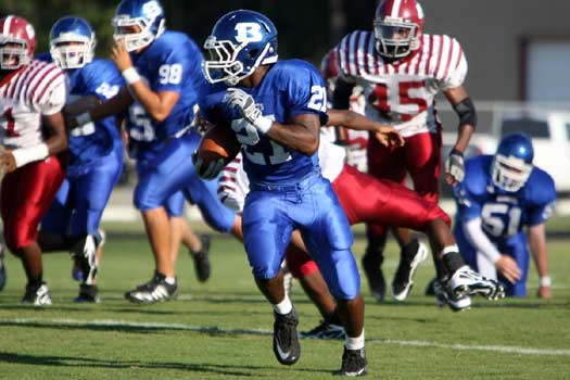 Chris Rycraw (21) takes off on his 48-yard touchdown run early in Monday's scrimmage. (Photo by Rick Nation)