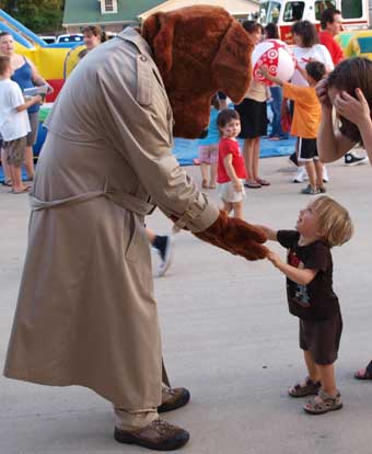 18-month old Seth Pope meets McGruff the Crime Dog. (Photo by Lana Clifton)