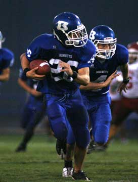 Senior linebacker Brennan Bullock returns an interception for a touchdown. (Photo by Rick Nation)