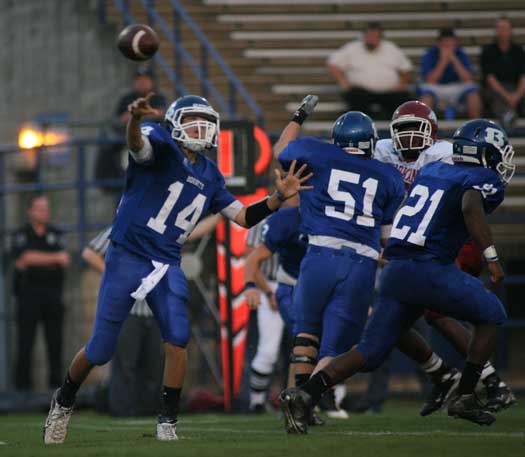 Senior tackle Kaleb Burns (51) protects quarterback Jimi Easterling as Chris Rycraw (21) carries out a fake. Easterling completed his first six passes on the way to a 12 for 16 night for 138 yards and three TDs against Texarkana. (Photo by Rick Nation)