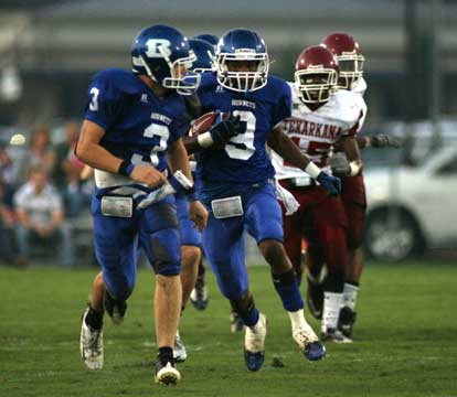 Sammill Watson (9), escorted by Brady Butler (3) returns a kickoff to set up Bryant's second touchdown Friday night. (Photo by Rick Nation)