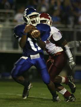 Sophomore Dillon Winfrey hauls in his first high school varsity touchdown pass. (Photo by Rick Nation)