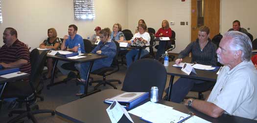 Class members of the 2009 Citizen’s Police Academy in Bryant listen as Sgt. Payte describes the requirements one must meet to become a police officer in Arkansas.  The first session of CPA met Tuesday, September 22 at 6:30 p.m.  The class will meet every Tuesday night for 6 weeks and will attempt to educate every day citizens about some of the realities of the life of police officers. (Photo by Lana Clifton)