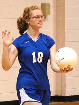 Lana Naumann prepares to serve for the Lady Hornets' junior varsity. (Photo by Mark Hart)