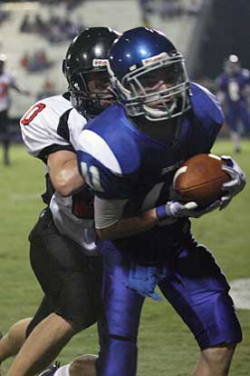 Hayden Daniel hauls in a pass in front of a Searcy defender. (Photo by Rick Nation)
