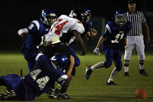 Bryant's Jared Koon (44), Aronn Bell (8) and Hunter Berry (31) converge on Searcy's Javien Reynolds forcing a fumble that Dakota Johnson (obscured here) recovered for the Hornets. (Photo by Rick Nation)