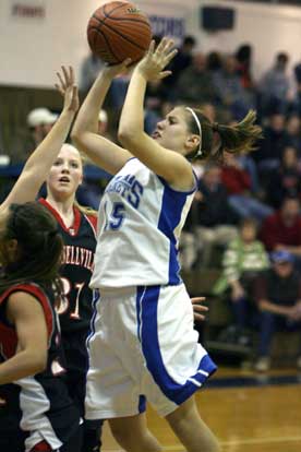 Sophomore Brittney Ball launches a shot over a Russellville defender. (Photo by Rick Nation)