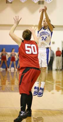 Hannah Goshien launches a shot over Cabot's Stephanie Odom. (Photo by Rick Nation)