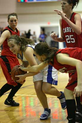 Bryant's Brooke Parish fights for a rebound amid three Cabot players. (Photo by Rick Nation)