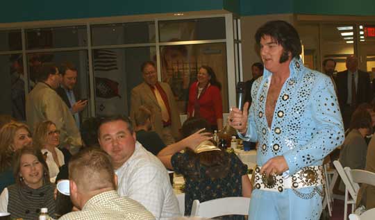 Tony Witt, Elvis tribute artist, entertains crowd during silent auction. (Photo by Lana Clifton)