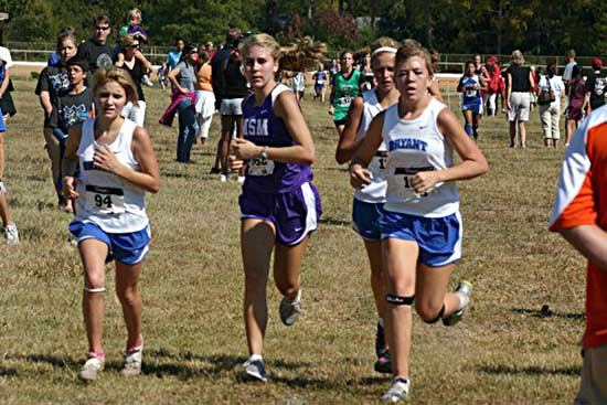 Bryant runners, from left, Kat Bolton, Ashlyn Lessenberry and Mikayla Douglas contend with a runner from Mount St. Mary's at Hot Springs Saturday.