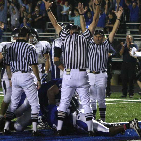 The officials signal the touchdown as Bryant's Marcus Harris covers the fumble in the end zone at the end of the second overtime. (Photo by Rick Nation)