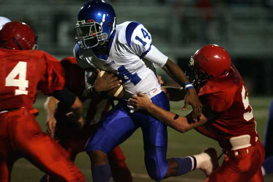 Madre London (14) fights for extra yardage. (Photo by Rick Nation)