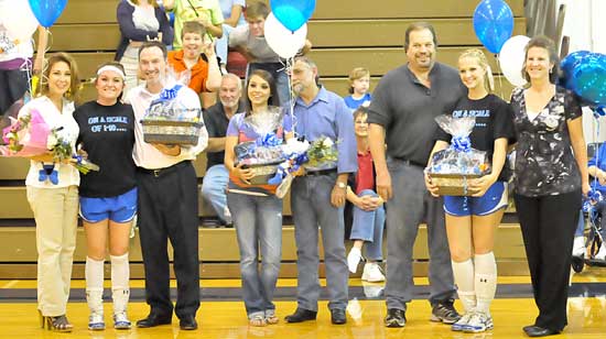 From left, Sydney Manley, Sarah Holt, Amber Cope and their families joined in celebrating their final home match for the Bryant Lady Hornets volleyball team Thursday. (Photo by Kevin Nagle)