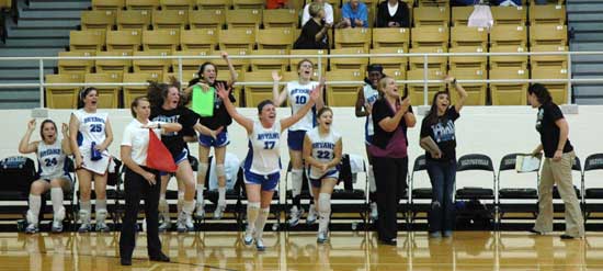 The Bryant bench celebrates the team winning a tight third set to take their State tourney opener over Rogers Heritage Tuesday. (Photo by Mark Hart)