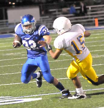 Bryant's Jason Browning (32) tries to get around North Little Rock's Michael Casey. (Photo by Kevin Nagle)