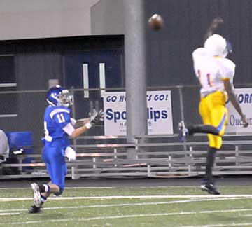 Austin Miller, left, looks in a long pass over the head of North Little Rock's Marquez Jones. (Photo by Kevin Nagle)