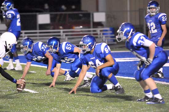 Bryant's defensive line Tanner Rich (70), James Gibson (65), Amador Gaspar (64) and Austin Miller (33), along with defensive back Matt Mears (22) set up near the goal line. (Photo by Kevin Nagle)