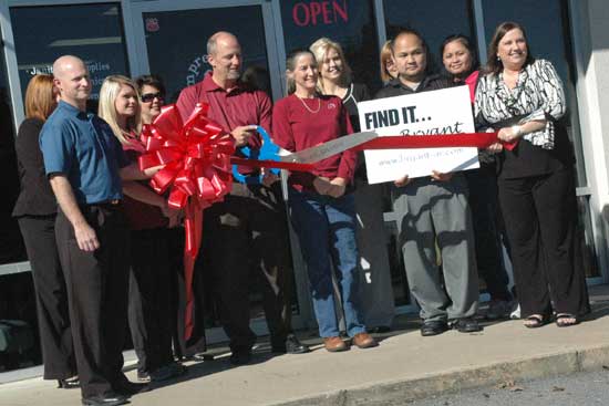 Members of the Bryant Chamber of Commerce gathered to celebrate the opening of First Impressions in Bryant on Thursday with a ribbon-cutting ceremony. 