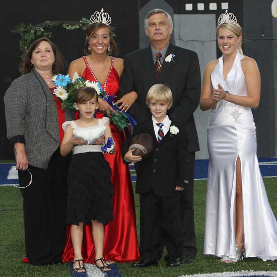 2010 Homecoming queen Stephanie Friemel and her family along with 2009 queen Kara Prichard, right, who crowned her successor. (Photo by Rick Nation)