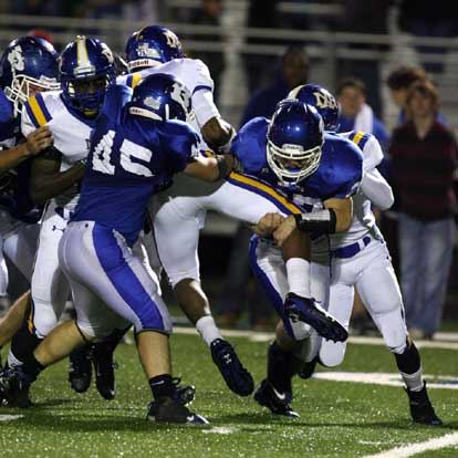 North Little Rock quarterback Kaylon Cooper gets a lift frm Collin Chapdelaine (45) and Jacob Brady (27). (Photo by Rick Nation)