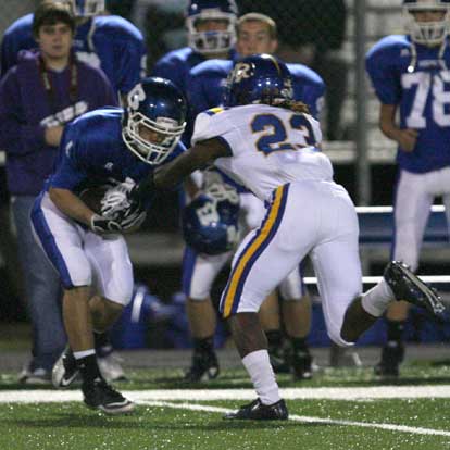Sawyer Nichols, left, secures a pass as North Little Rock's Derius Johnson (23) defends. (Photo by Rick Nation)