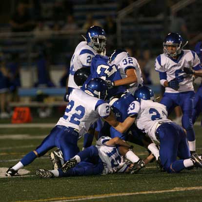 Conway White's Kwan Tolbert (22) is piled up by Bryant's Matt Mears (22), Jason Browning (32), Jacob Irby (15), Davis Nossaman (23) and Greyson Giles (20) as Chase Tucker (6) arrives. (Photo by Rick Nation)