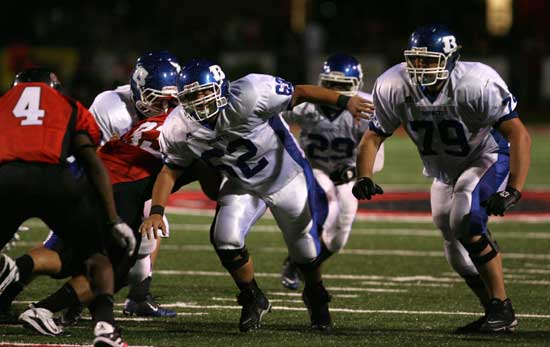 Bryant's Landon Pickett (62) and Colby Maness (79) lead the way for running back Stephen Clark. (Photo by Rick Nation)