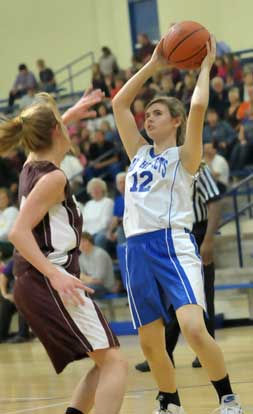 Mercedes Dillard (12) looks for an open teammate. (Photo by Kevin Nagle)