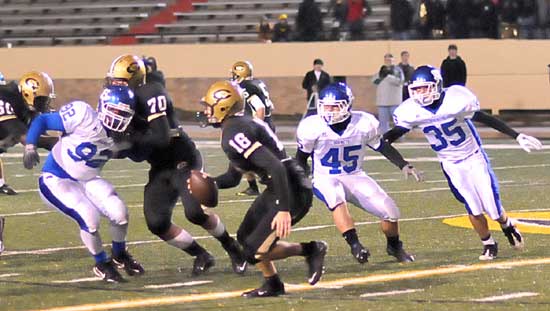 Bryant's James Kidd (92), Collin Chapdelaine (45) and Jesse Johnson (35) put the pressure on Little Rock Central quarterback Cole Westbrook during last Friday's game. (Photo by Kevin Nagle)