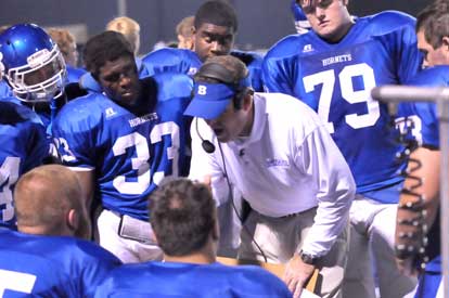 Bryant head coach Paul Calley visits with the offense during Friday's game. (Photo by Kevin Nagle)