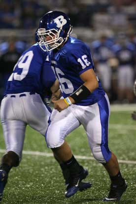 Bryant quarterback Hayden Lessenberry (16) hands off to Stephen Clark. (Photo by Rick Nation)