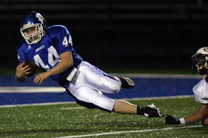 Dylan Pritchett lunges towards the goal line. (Photo by Rick Nation)