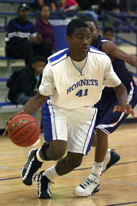 Madre London drives past a J.A. Fair defender. (Photo by Rick Nation)