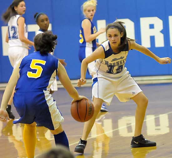 Bryant's Rori Whittaker (15) defends against Lakeside's Emily Couch (5) during Monday night's game. (Photo by Kevin Nagle)
