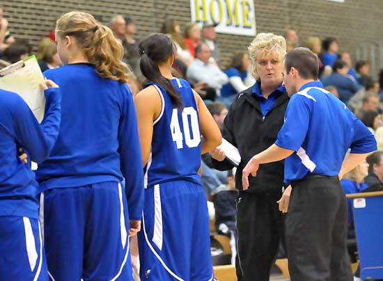 Bryant coaches Blake Condley and Monica Parish discuss strategy during a timeout. (Photo by Kevin Nagle)